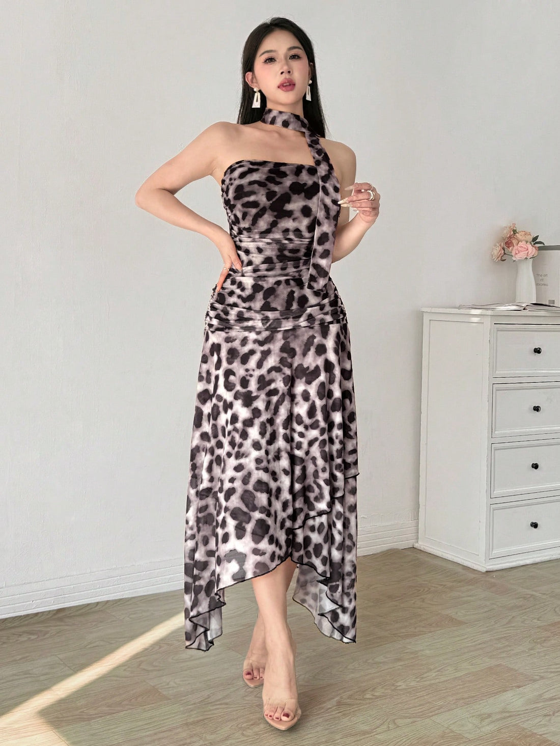 Step out in style for your next date night with our Elegant Leopard Print Mesh Tube Dress. With its eye-catching leopard print, elegant pleats, and playful ribbons, this dress is sure to turn heads and make you the center of attention. Perfect for the fashion-forward and bold, this dress is a must-have for any stylish date night.