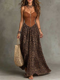 Front view of leopard-print maxi dress with brown zip-front bodice and flowing skirt