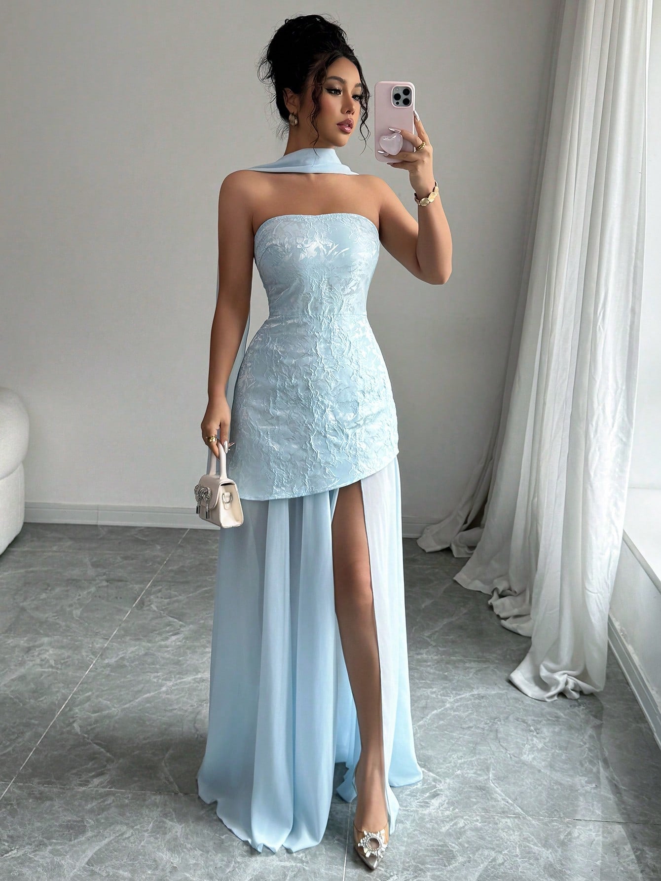 Step into summer with this playful light blue bandeau dress that effortlessly blends elegance and fun. The delicate waist slit adds a flirty touch, perfect for dancing the night away at any formal event. Its sleek silhouette highlights your curves while keeping you cool and comfortable. Make every moment memorable in this chic, sun-kissed look!