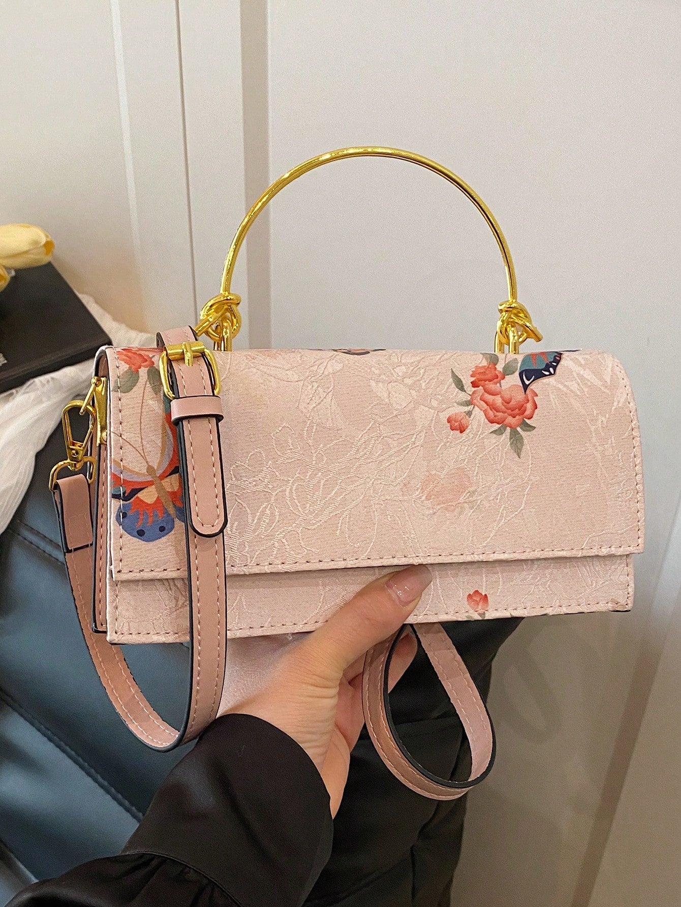 Flutter into any special event with this elegant light pink jacquard handbag, adorned with delicate butterfly decorations. Perfectly suited for weddings and other special occasions, this handbag adds a touch of whimsy and sophistication to any outfit. Say "I do" to this beautiful accessory today!