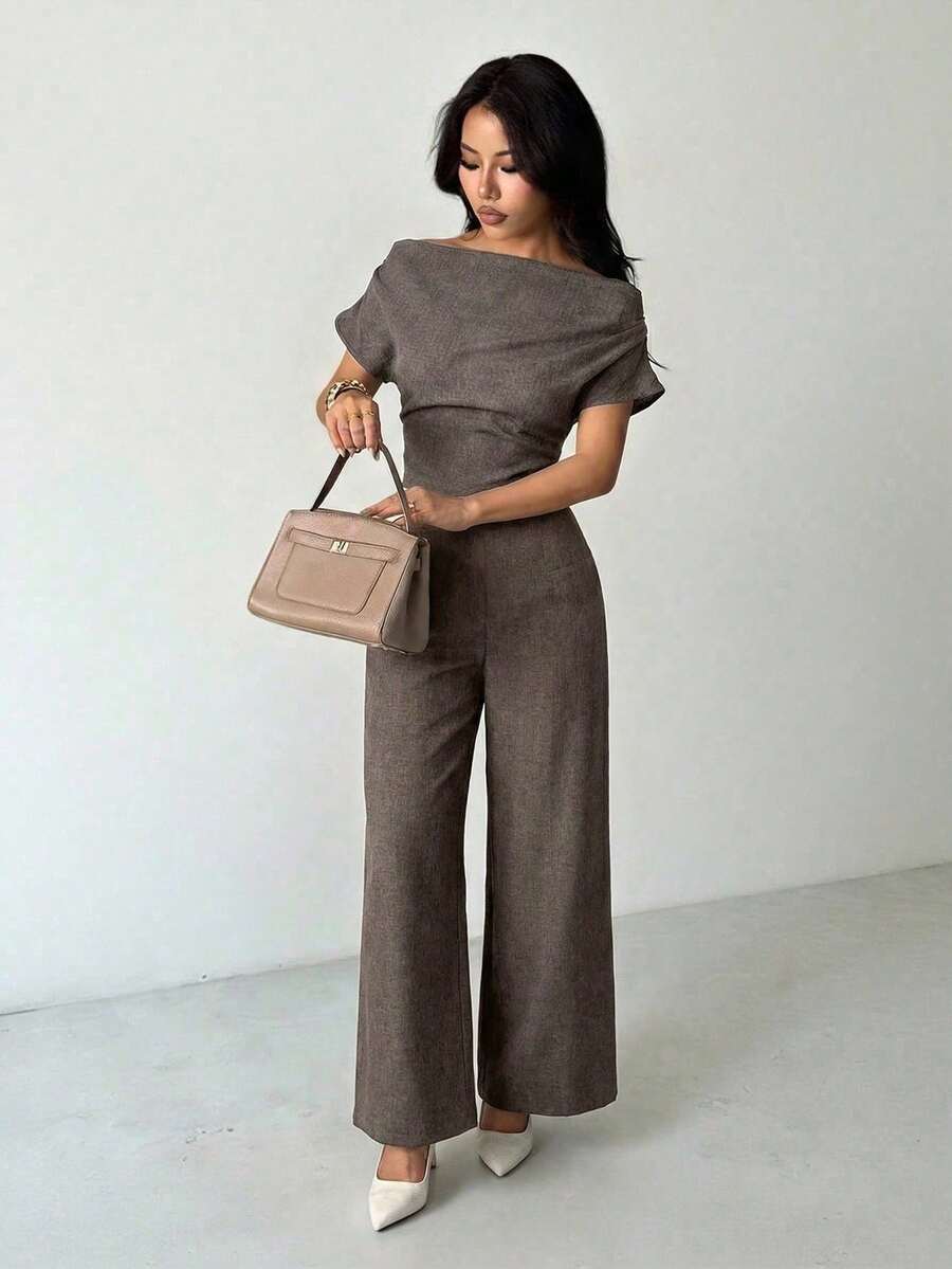 Elevate your wardrobe with this sophisticated linen suit designed for petite frames. The off-shoulder blouse features elegant batwing sleeves and an asymmetrical neckline with subtle ruching details, while the wide-leg pants offer a flattering silhouette. Crafted from breathable 100% polyester in a rich coffee brown, this versatile set transitions seamlessly from office to special occasions.