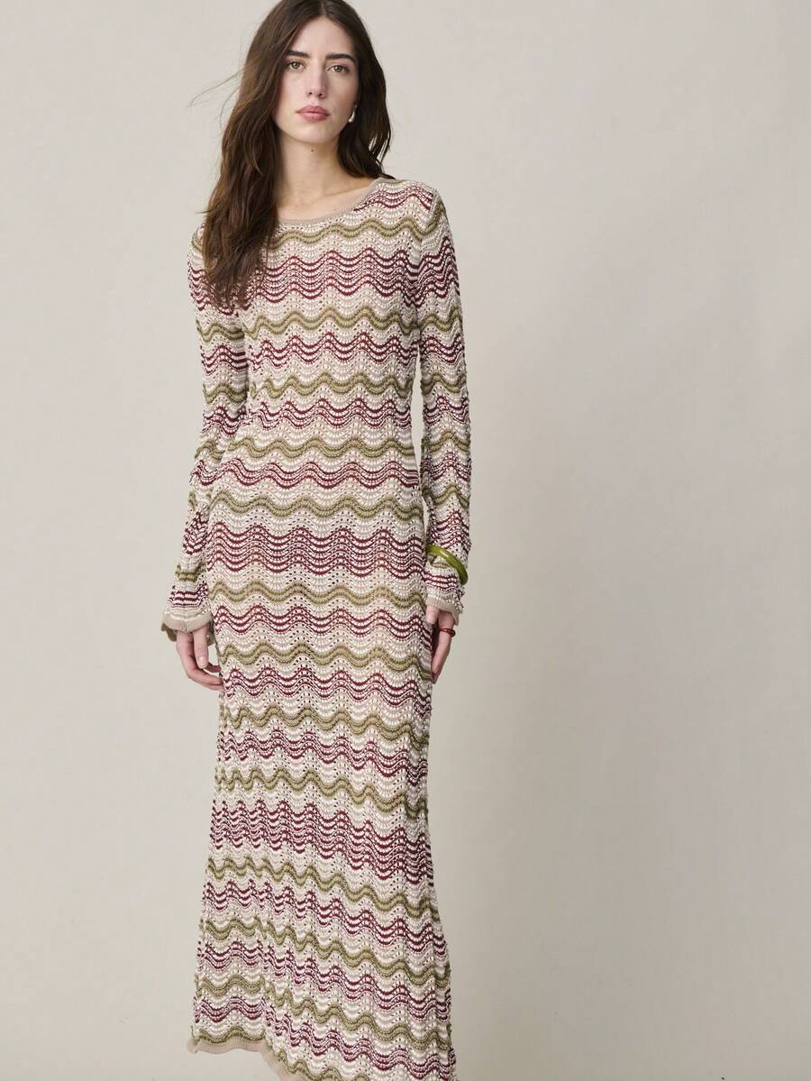 Elevate your wardrobe with this sophisticated midi knit dress, designed for effortless elegance. Featuring a classic round neckline, extra-long sleeves, and a gracefully flared hem with subtle slits, this piece transitions seamlessly from casual outings to special occasions. The all-over print and rib-knit detailing add visual interest, while the natural waistline flatters your silhouette. Crafted from 100% polyester knitwear with a semi-sheer finish, it's perfect for spring and summer celebrations. Ideal f