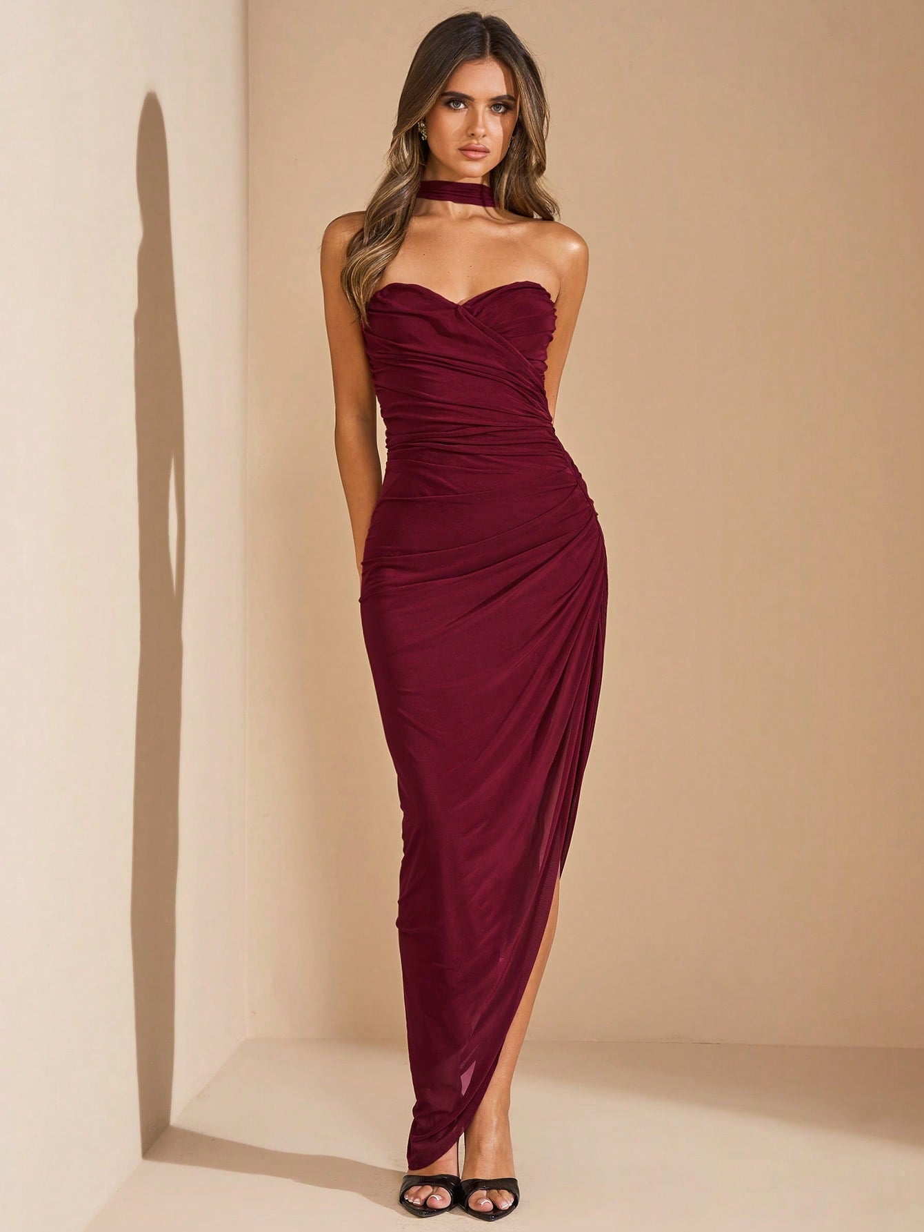 Make a statement without saying a word in our long black ruched bodycon dress! This strapless stunner hugs your curves in all the right places, taking you from mimosa-filled brunches to beachside "I do's" with effortless glam. Pack this versatile beauty for your next getaway – because vacation photos deserve this level of fabulous!