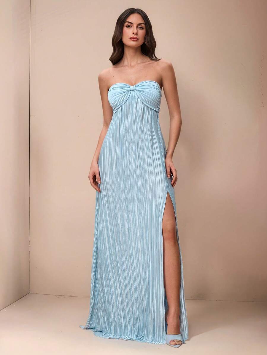 Slip into effortless elegance with this stunning maxi halter dress that's ready to turn heads at any celebration. The flowing silhouette drapes beautifully while the halter neckline offers a flattering, sophisticated touch. Whether you're walking down the aisle as a bridesmaid or dancing under the stars at a summer wedding, this versatile piece transitions seamlessly from ceremony to celebration. The lightweight fabric keeps you cool and comfortable all day long, while the timeless design ensures you'll rea