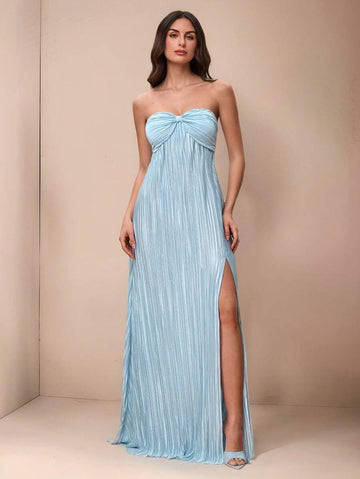 Slip into effortless elegance with this stunning maxi halter dress that's ready to turn heads at any celebration. The flowing silhouette drapes beautifully while the halter neckline offers a flattering, sophisticated touch. Whether you're walking down the aisle as a bridesmaid or dancing under the stars at a summer wedding, this versatile piece transitions seamlessly from ceremony to celebration. The lightweight fabric keeps you cool and comfortable all day long, while the timeless design ensures you'll rea