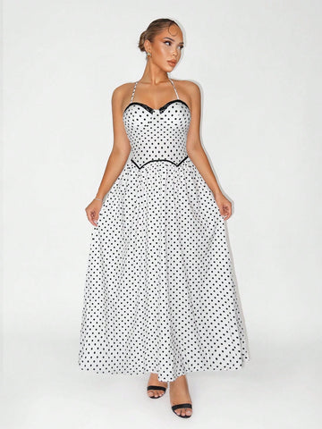 Twirl into vacation mode with this stunning long polka dot dress that effortlessly blends timeless elegance with playful charm. The classic black and white palette pairs perfectly with any occasion—from beachside getaways to evening soirées. Crafted for comfort and style, this dress features a flattering silhouette that moves beautifully with you. Whether you're sipping cocktails by the pool or exploring a new destination, this versatile piece is your go-to for looking polished and put-together. Pack it, we