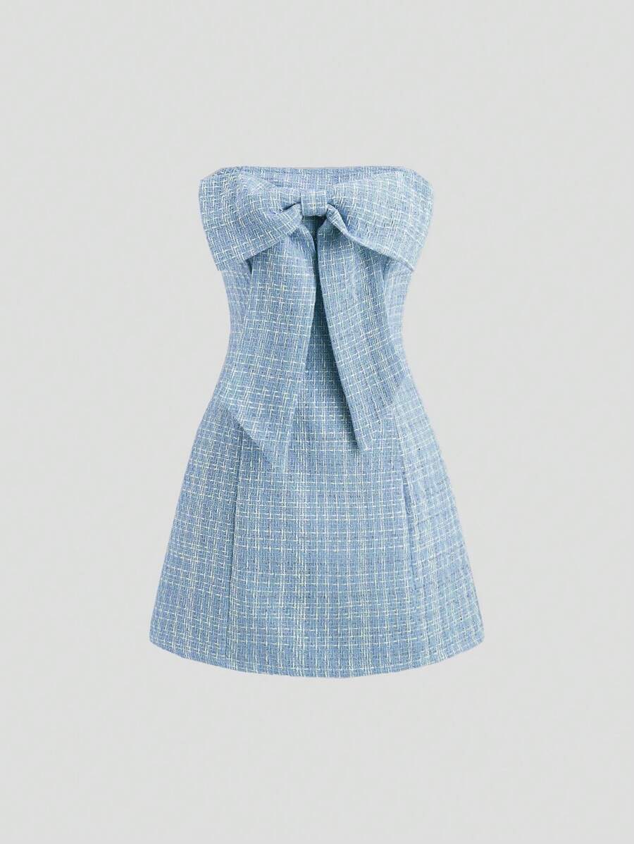 Turn heads at your next holiday party with this playful magenta tube top dress. Inspired by Y2K French chic, it features a charming bowknot detail that adds a flirty touch. Perfect for dancing the night away or making a stylish statement, this dress combines elegance with fun for unforgettable festive vibes.