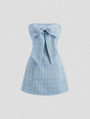 Turn heads at your next holiday party with this playful magenta tube top dress. Inspired by Y2K French chic, it features a charming bowknot detail that adds a flirty touch. Perfect for dancing the night away or making a stylish statement, this dress combines elegance with fun for unforgettable festive vibes.