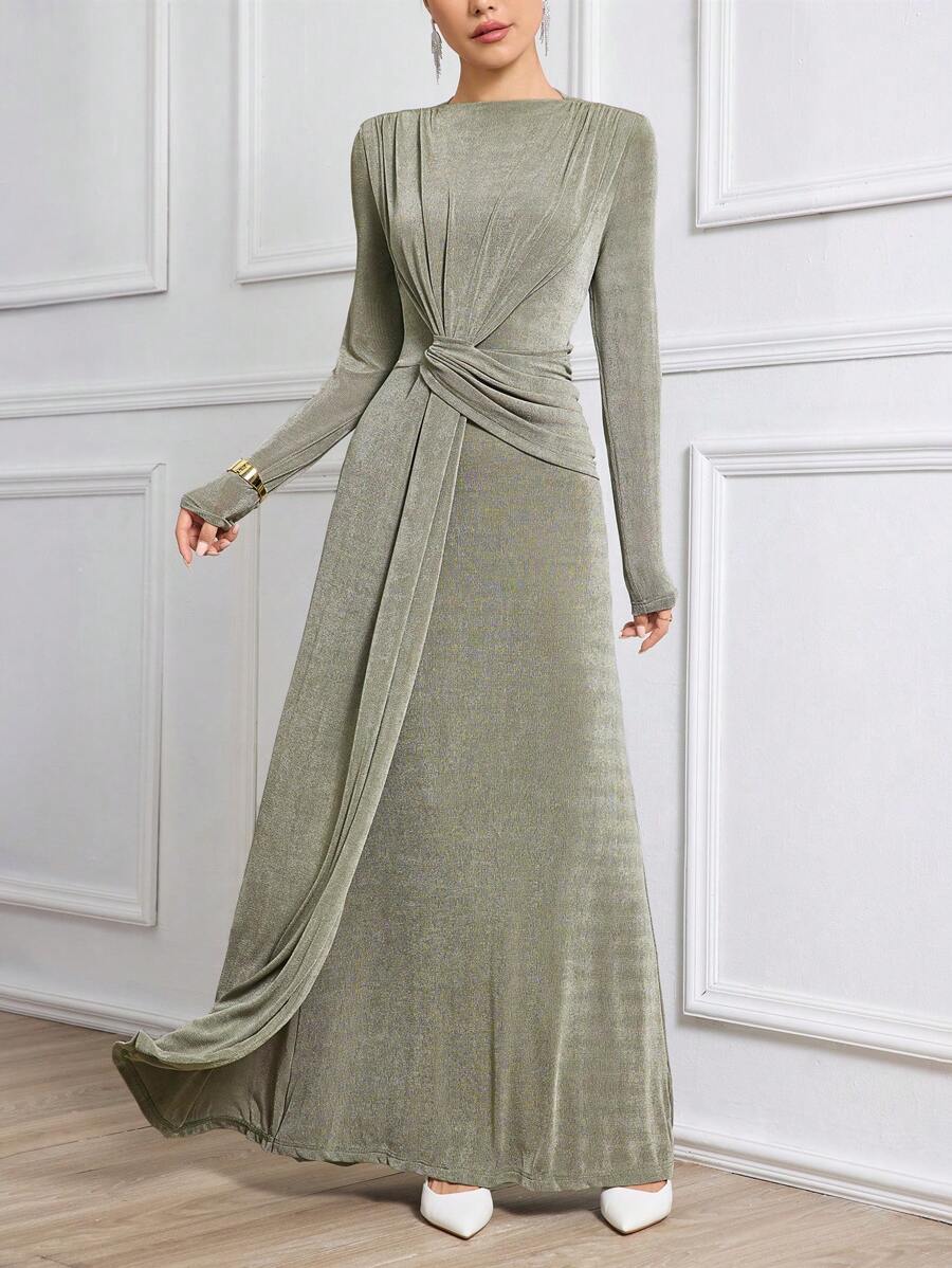 Elevate your evening wardrobe with this sophisticated maxi dress, crafted from a luxurious knitted fabric blend of 95% polyester and 5% elastane. Featuring elegant ruching and a twist detail, this slim-fit gown boasts a high waistline and flared hem for a flattering silhouette. The round neckline and long sleeves provide modest coverage, while the back zipper ensures easy wear. Perfect for formal occasions, celebrations, and festive gatherings, this red violet dress combines comfort with timeless elegance. 