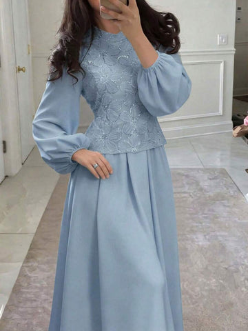 Powder blue two-piece maxi dress set with floral sequined bodice, bishop sleeves, flowing skirt, mirror front view