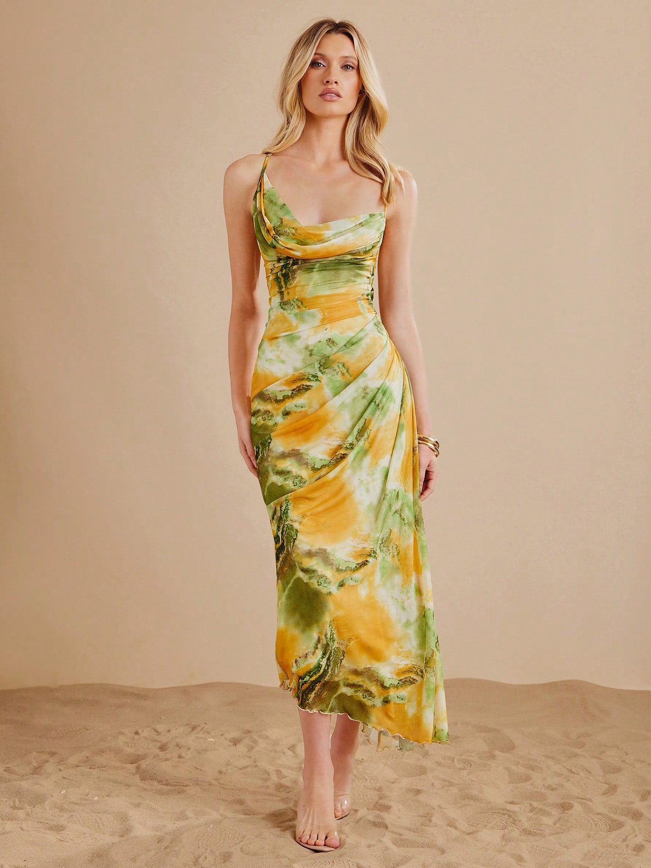 Step into summer with this Elegant Mesh Tie-Dye Maxi Dress, designed to keep you cool and stylish on every vacation. Its breezy mesh fabric flows effortlessly, while the vibrant tie-dye pattern adds a fun, playful vibe. Perfect for beach strolls or sunset dinners, this maxi dress combines comfort with eye-catching flair to make your summer memories unforgettable.