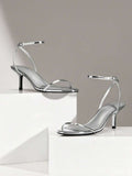 Step into sophistication with these stunning metallic ankle strap stiletto heels. Crafted for the modern woman who demands elegance, these sandals feature a sleek metallic finish that catches the light with every stride. The secure ankle strap ensures comfort and stability, while the elevated stiletto heel adds instant glamour to any occasion. Perfect for summer evenings, special celebrations, or Valentine's Day moments, these heels transition seamlessly from day to night. 