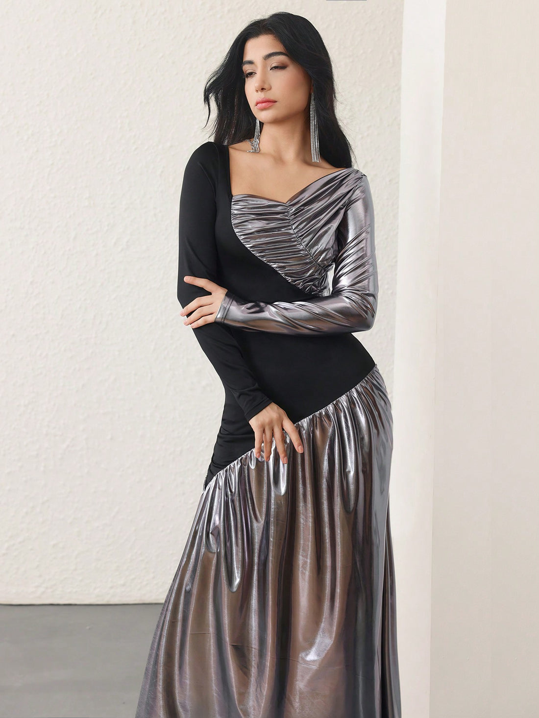 Get ready to turn heads with our Elegant Metallic Bodycon Knit Dress! Perfect for any fashion-forward woman, this dress boasts a stylish long splice design that adds a touch of uniqueness to your outfit. Made with a bodycon knit, this dress hugs your curves in all the right places, giving you a stunning silhouette. Elevate your style game with this statement-making dress!