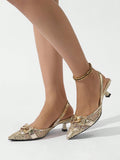 Add a touch of elegance and playfulness to your spring/summer events with these Metallic Gold Pointed Toe High Heel Pumps. The chain strap and lace patchwork adds a unique and trendy touch to these pumps. Perfect for standing out and making a statement!