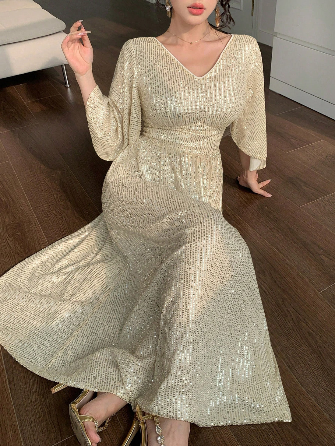 Turn heads at every celebration with this elegant mid-length sequin dress. Featuring a flattering V-neck and charming ruffle sleeves, it adds a fun, flirty touch to your party look. Sparkle effortlessly while enjoying comfort and style that moves with you. Perfect for dancing the night away or making a glamorous entrance!
