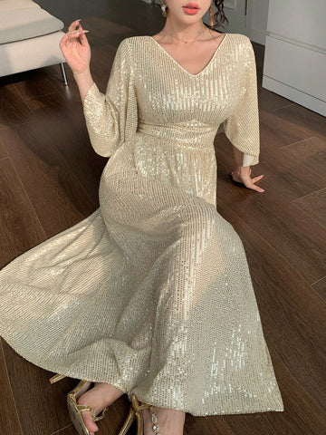 Turn heads at every celebration with this elegant mid-length sequin dress. Featuring a flattering V-neck and charming ruffle sleeves, it adds a fun, flirty touch to your party look. Sparkle effortlessly while enjoying comfort and style that moves with you. Perfect for dancing the night away or making a glamorous entrance!