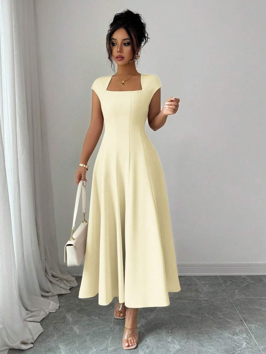 Discover timeless elegance with this sophisticated midi dress, designed for the modern woman who values both style and comfort. The flattering square neckline frames your shoulders beautifully, while the flowing A-line silhouette skims your figure gracefully. Perfect for spring and summer occasions—from casual brunches to garden parties—this versatile piece transitions effortlessly from day to evening. Crafted with quality fabrics that move with you, it's an essential addition to any wardrobe. 
