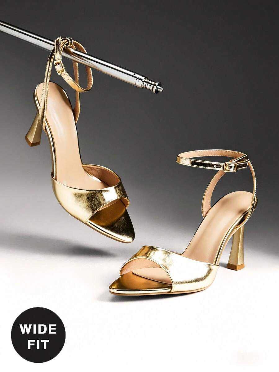 Sophisticated stiletto sandals designed for the modern woman who values both style and comfort. The minimalist ankle strap provides secure support while elongating the leg, while the wide fit accommodates fuller feet without compromising elegance. Crafted with a sleek silhouette, these heels transition seamlessly from evening events to upscale dinners. The stiletto heel adds timeless glamour to any outfit, from dresses to tailored trousers. 