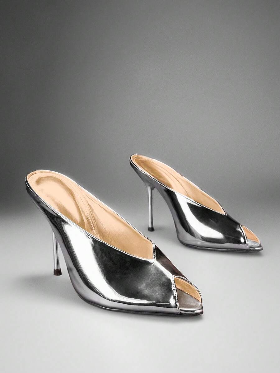 Silver front three-quarter product view of peep-toe stiletto mule sandals with a backless slip-on upper and slim high heel