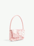 Carry your essentials in style with this charming pink shoulder bag that blends delicate lace florals with modern minimalism. The soft, romantic design pairs perfectly with any outfit—from casual weekend looks to dressed-up occasions. Lightweight and versatile, it's the perfect companion for anyone who loves understated elegance with a touch of whimsy. Whether you're heading to brunch or a night out, this bag adds just the right amount of personality to your ensemble.