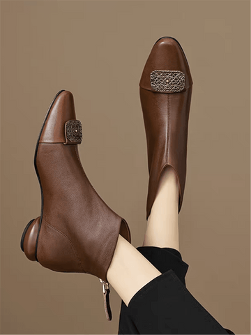 Step into sophistication with these chic pointed-toe short boots that blend minimalist elegance with edgy flair. Featuring a sleek silhouette and eye-catching metal plate detailing, they're the perfect statement piece for elevating your fall and winter wardrobe. Whether you're dressing up for a night out or adding polish to everyday looks, these boots deliver that coveted balance of refined style and bold personality. Comfortable enough for all-day wear, they're your new go-to for turning heads and feeling 