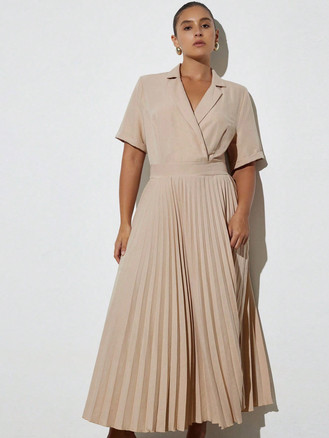 Step into the office with a dash of charm in this Elegant Minimalist Short Sleeve Dress. Its clean crew neck and playful pleated hem add a fun twist to classic simplicity, making it perfect for workdays that need a little extra flair. Comfortable and chic, it’s your new go-to for effortless style that means business.