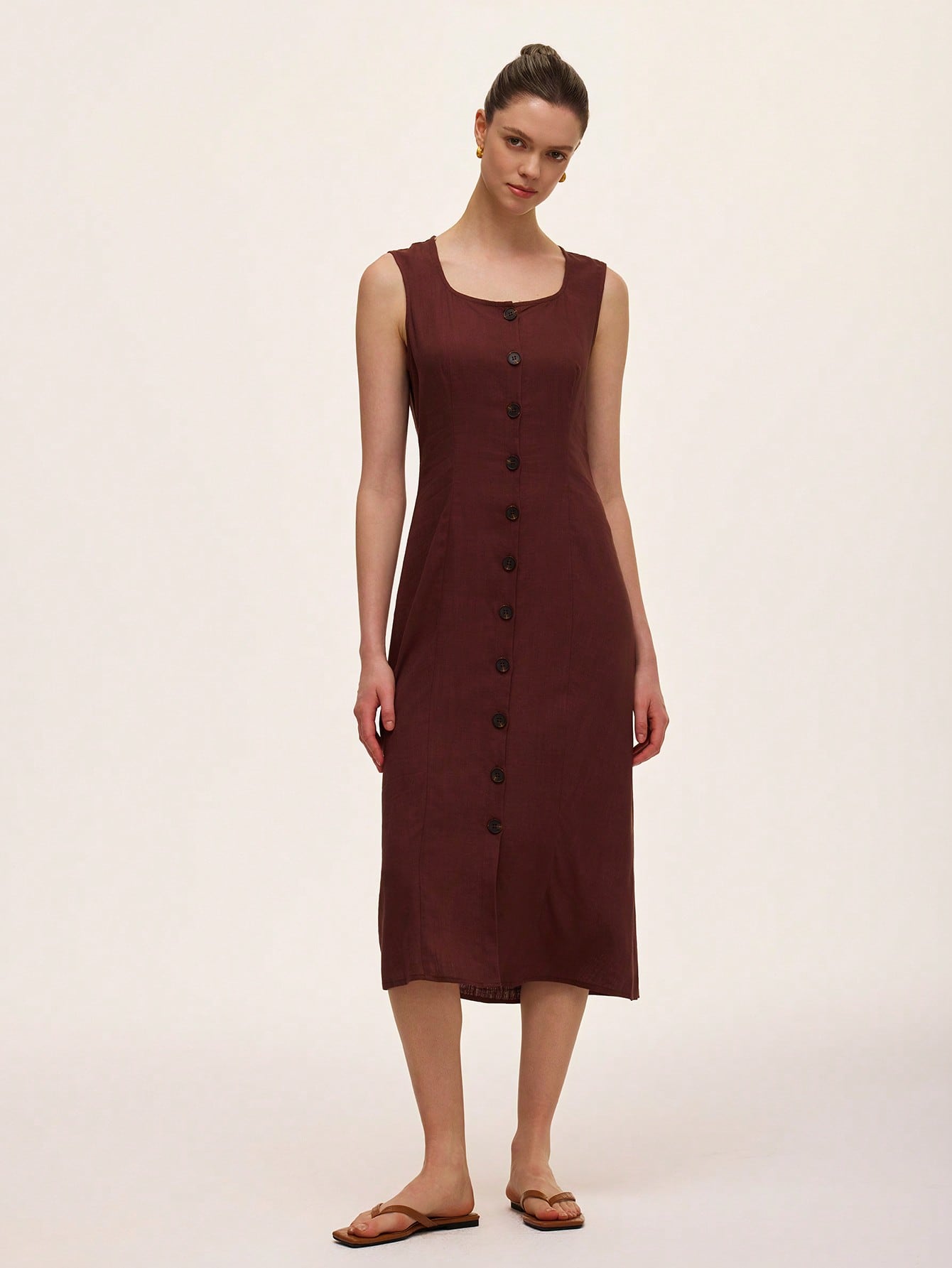 Step out in style with this Elegant Minimalist Sleeveless Button Front Dress! Its sleek, solid color design keeps things simple yet chic, perfect for casual days or spontaneous adventures. The button front adds a fun twist, making it easy to dress up or down. Lightweight and breezy, this dress is your new go-to for effortless cool vibes all day long.