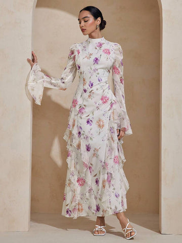 Twirl into elegance with this charming modest dress that celebrates timeless style. Featuring a delicate floral print that dances across the fabric, this extra-long silhouette offers graceful coverage while the playful ruffle hem adds a touch of whimsy. The adjustable tie waist lets you cinch and customize your fit, creating a flattering shape that feels just right. Perfect for garden parties, casual outings, or whenever you want to feel put-together and fabulous. Comfort meets sophistication in one delight