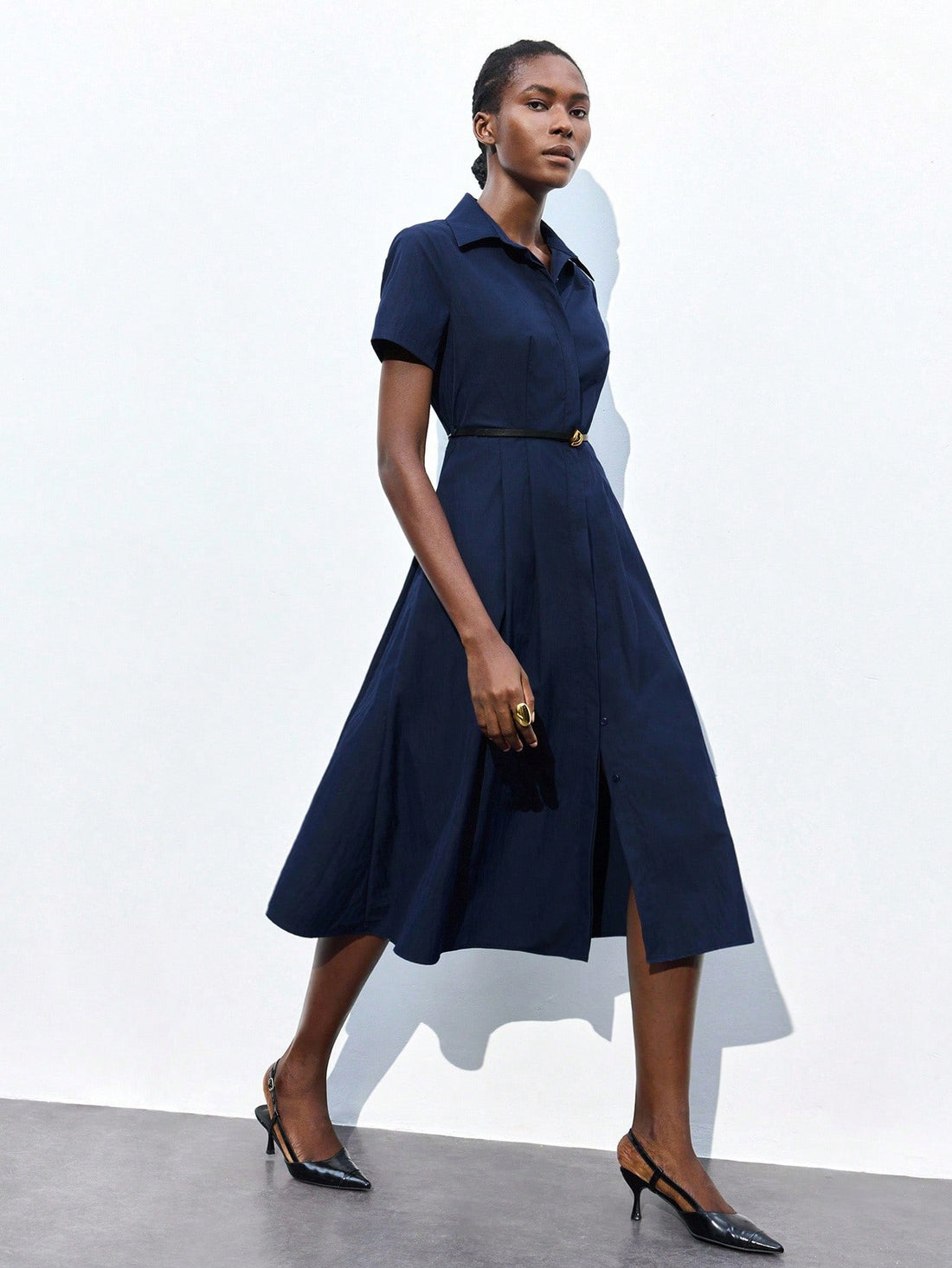 Step into style and confidence with this elegant navy blue collared dress, perfect for both business meetings and lively parties. Its short sleeves keep you cool while the tailored fit highlights your silhouette beautifully. Whether closing deals or dancing the night away, this dress adds charm and sophistication to any occasion.