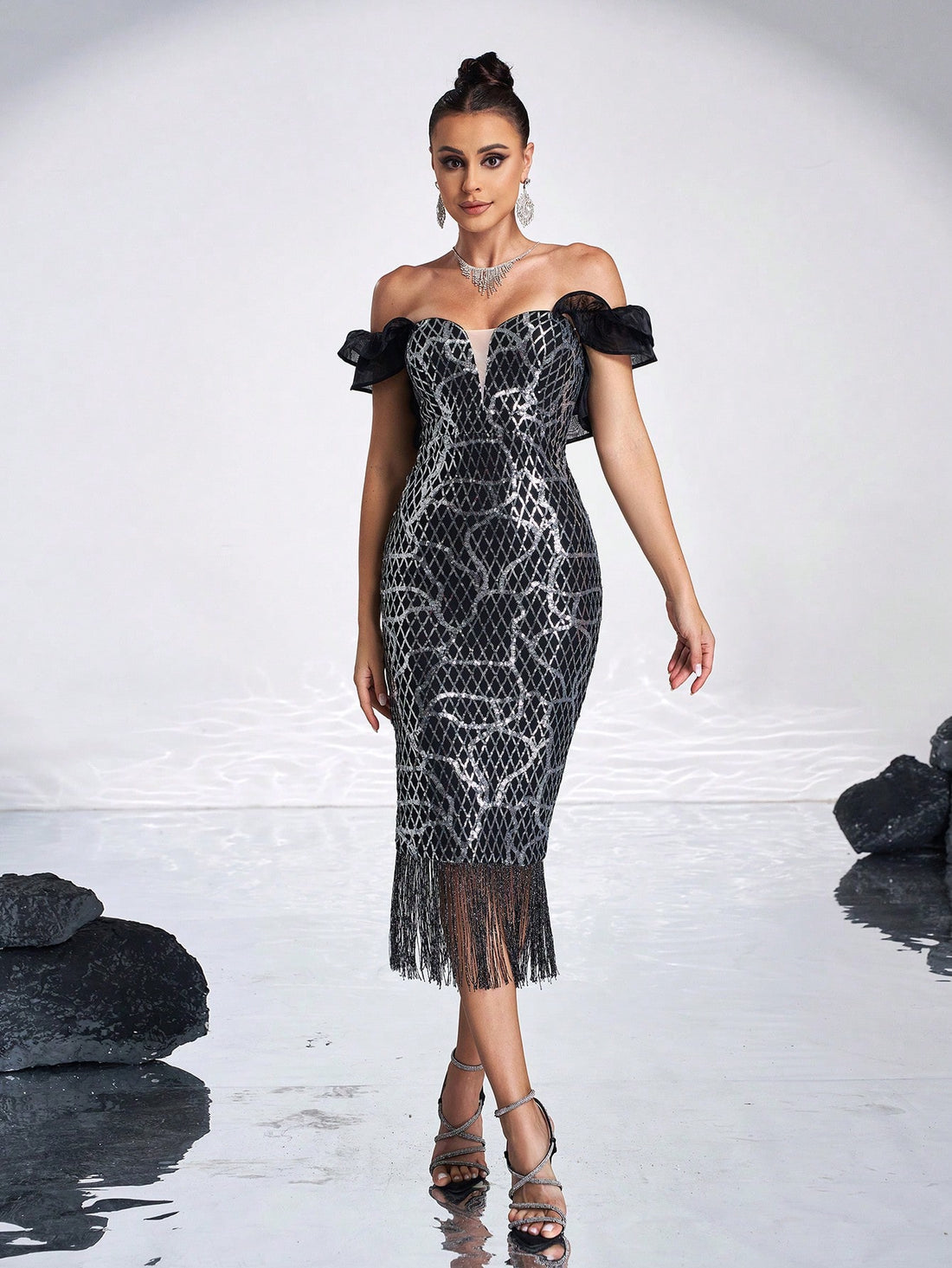 Turn heads at any formal event with this playful off-shoulder cocktail dress. Featuring shimmering sequins and delicate mesh ruffles, its long silhouette adds a touch of elegance while keeping the vibe fun and flirty. Perfect for dancing the night away in style!