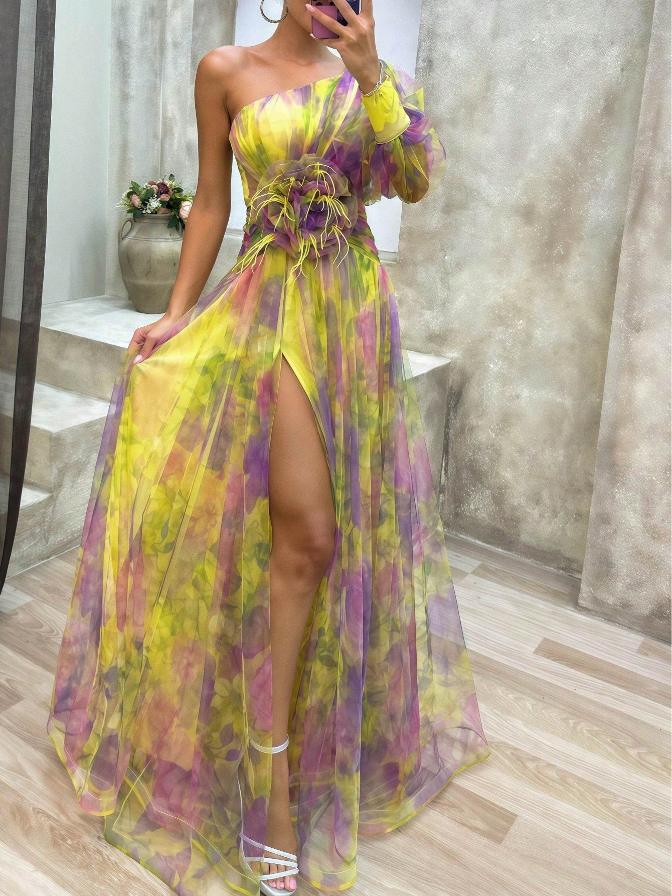 Turn heads at every formal event or garden party with this playful one-shoulder maxi gown. The charming 3D floral appliqué adds a whimsical touch, while the high slit brings a flirty edge to your look. Flowing and graceful, it’s perfect for dancing the night away or stealing the spotlight wherever you go. Embrace elegance with a fun twist!