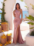 Make a statement in this stunning one-shoulder ruched bodycon maxi dress. The elegant asymmetrical neckline and figure-hugging silhouette create a sophisticated look, while the high slit adds movement and allure. Ruched detailing along the bodice provides flattering texture and dimension. Perfect for prom, formal events, or special occasions where you want to turn heads. The maxi length offers timeless elegance with modern edge.