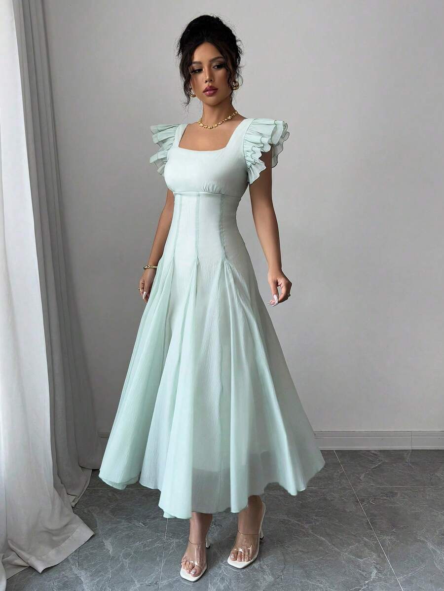 Elevate your everyday style with this charming pale green midi dress that strikes the perfect balance between sophisticated and fun. The flattering square neckline frames your shoulders beautifully, while delicate ruched cap sleeves add a touch of playful texture and dimension. Perfect for brunch dates, garden parties, or whenever you want to feel effortlessly put-together, this versatile piece transitions seamlessly from day to night. The midi length offers timeless elegance with a modern twist that'll hav