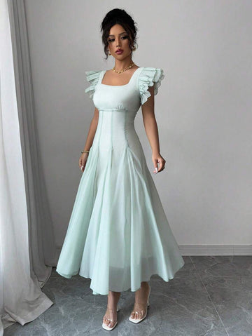 Elevate your everyday style with this charming pale green midi dress that strikes the perfect balance between sophisticated and fun. The flattering square neckline frames your shoulders beautifully, while delicate ruched cap sleeves add a touch of playful texture and dimension. Perfect for brunch dates, garden parties, or whenever you want to feel effortlessly put-together, this versatile piece transitions seamlessly from day to night. The midi length offers timeless elegance with a modern twist that'll hav