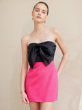 Step into the spotlight with this playful and chic mini dress! Featuring a sleeveless design and eye-catching contrast colors, it’s perfect for turning heads at any party. The charming bowknot waist adds a flirty touch, flattering your silhouette while keeping things fun and feminine. Ideal for dancing the night away or making a stylish entrance, this dress combines elegance with a dash of whimsy.