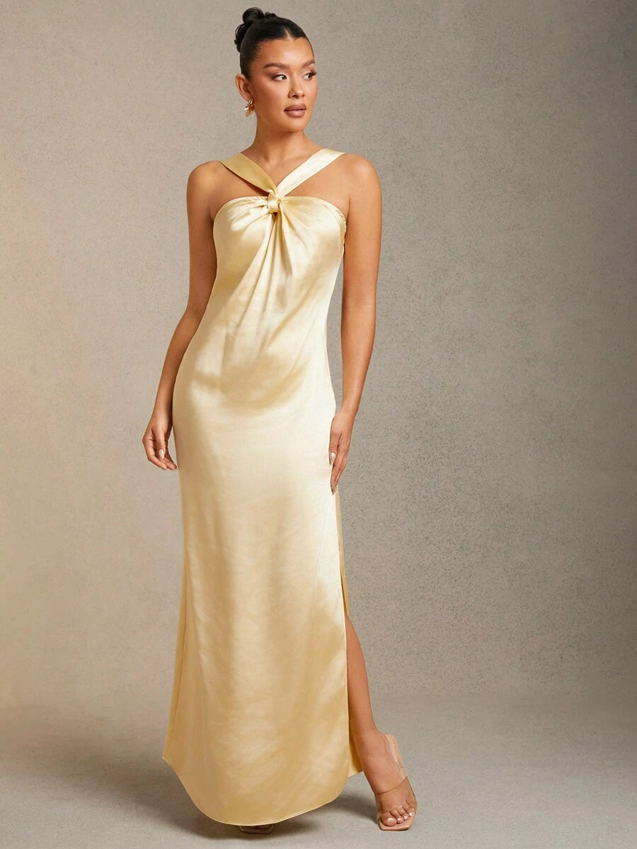 Step into the spotlight with this Elegant Pastel Butter Yellow Satin Maxi Dress. The silky satin fabric glides effortlessly, while the playful twist front adds a charming touch that’s perfect for wedding guests. Its soft pastel hue will brighten any celebration, combining comfort and style in one stunning look. Ready to dance the night away? This dress has you covered in effortless elegance with a fun twist.