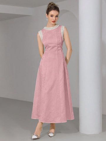 Step into the spotlight with this playful, pearl-embellished sleeveless long dress, perfect for weddings and special occasions. Its delicate pearls add a touch of whimsy and elegance, while the flowing silhouette ensures you’ll dance the night away in comfort and style. Make every moment memorable in this charming dress designed to turn heads and spark smiles.