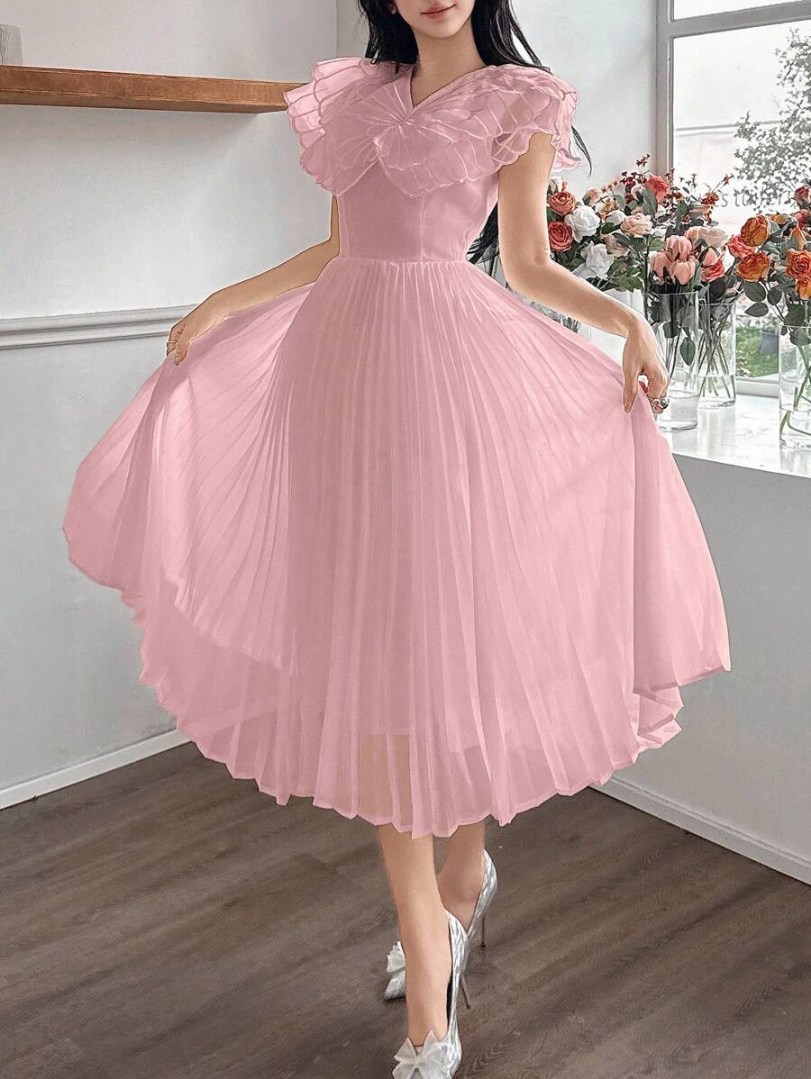 This playful mid-length dress features delicate butterfly embroidery that adds a whimsical touch to its soft pink fabric. The charming pleats create a graceful flow, making it perfect for twirling through sunny afternoons or special occasions. Embrace effortless elegance with a fun, flirty style that stands out wherever you go.
