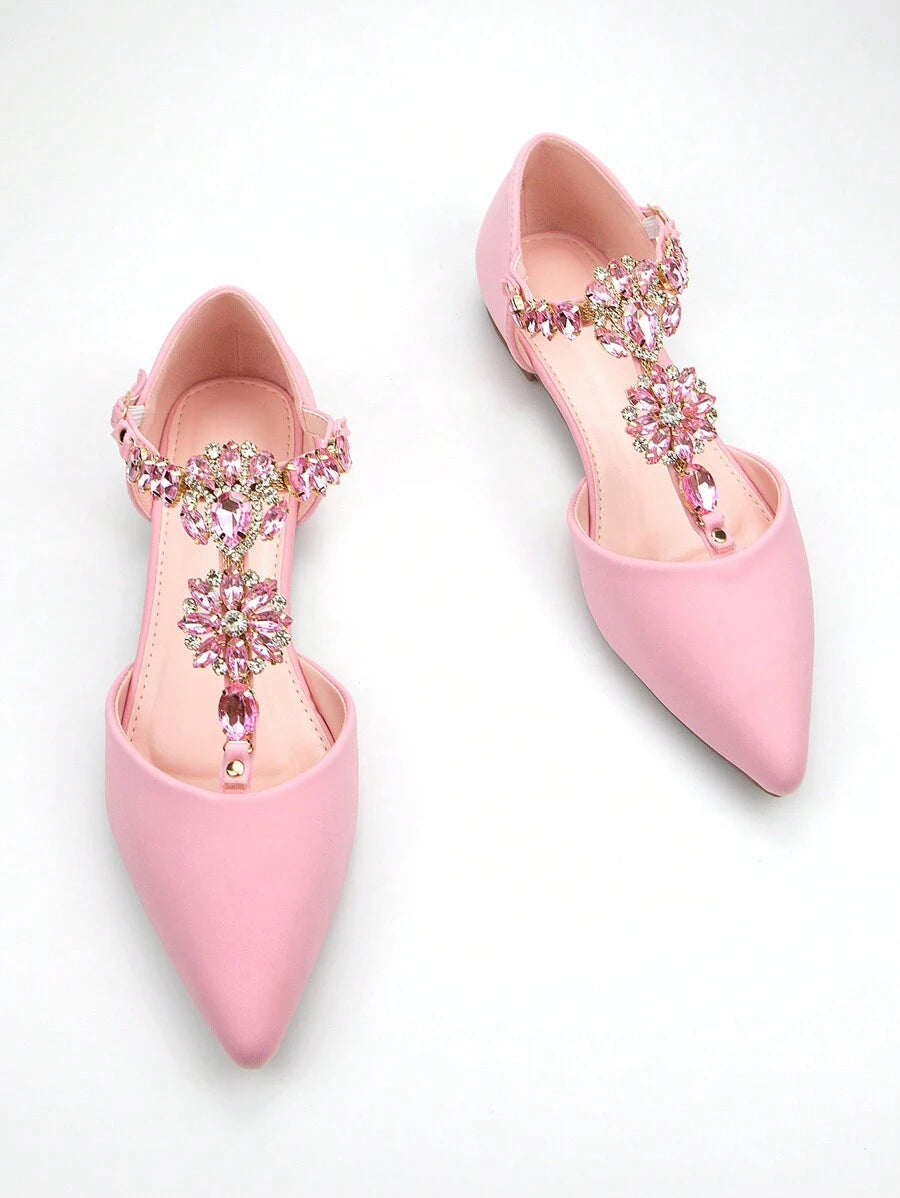 Step into elegance with these stunning pink rhinestone flat shoes, designed for those who refuse to compromise on style. Featuring a delicate ankle strap and sparkling rhinestone chain detailing, these handmade flats offer the perfect blend of sophistication and comfort. The pointed toe silhouette and buckle closure create a refined look ideal for both everyday wear and special occasions. Crafted with premium PU leather upper and lining, paired with a durable TPR outsole, these shoes deliver lasting quality