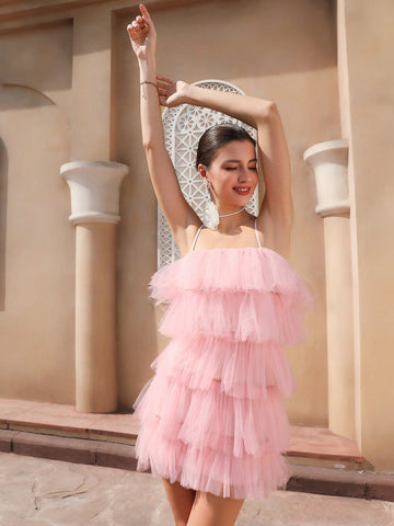 Be the belle of the ball in our Elegant Pink Tulle Ruffle A-Line Dress. With delicate spaghetti straps and a flattering square neckline, this dress is perfect for dancing the night away. The soft tulle material and feminine ruffle details add a touch of whimsy. Who says you can't be elegant and playful at the same time?!