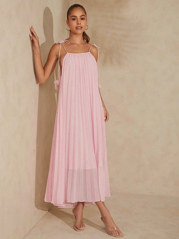 Elevate your summer style with our Elegant Pleated 3D Flower Maxi Dress! The delicate pleats and 3D flower design add a touch of elegance, while the strap tie detail adds a playful twist. Perfect for those who like to stand out from the crowd!