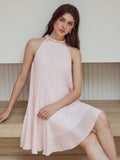 Step out in style with this Elegant Pleated Dress featuring charming faux pearl accents. Its flowing pleats add graceful movement, while the delicate pearl detailing brings a touch of whimsy and sophistication. Perfect for turning heads at any event, this dress combines playful elegance with timeless flair.
