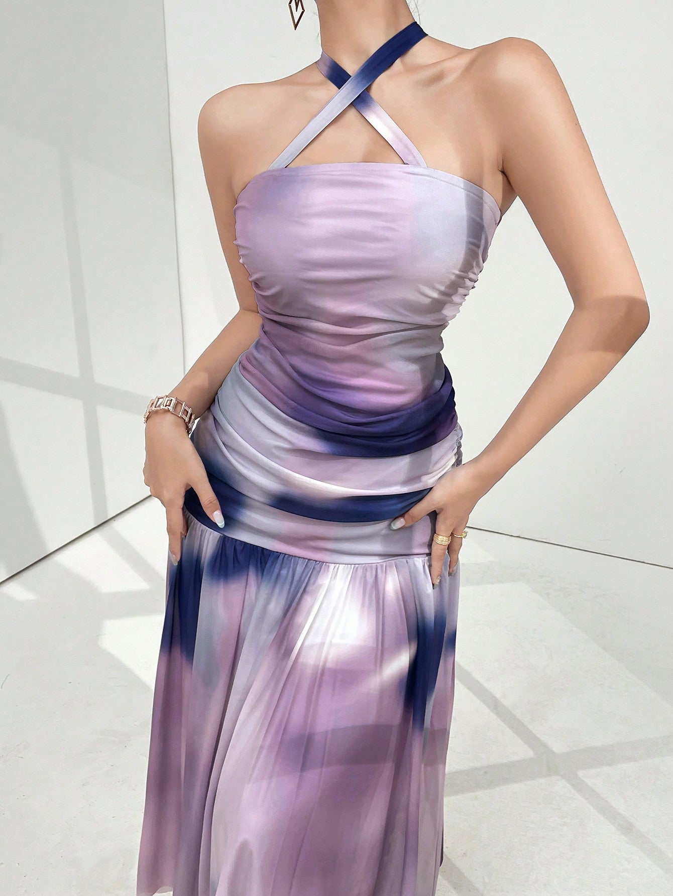 Spice up your summer party wardrobe with our Elegant Pleated Halter Backless Dress for Women! This stylish dress features a flattering halter neckline, pleated details, and a playful backless design. Perfect for any occasion, this dress will have you turning heads and feeling confident.