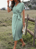 Introducing our Elegant Pleated V-Neck Dress in Mint Green, a timeless addition to your wardrobe for any occasion. The pleated design and flattering v-neckline create a sophisticated and elegant look. Crafted with high-quality materials, this dress is both stylish and comfortable. Elevate your style with this must-have piece.