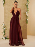 Expertly crafted with a sophisticated design, this elegant tulle maxi dress features a plunging neckline and dual slits. The perfect blend of haute couture style and modern elegance, this dress is a must-have for any formal occasion. Feel confident and stylish in this one-of-a-kind piece.