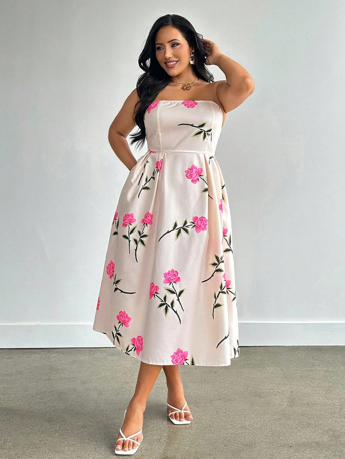 Step into summer with this playful plus-size A-line midi dress, featuring a charming rose print that blooms with every move. The strapless design keeps things breezy and fun, while handy pockets add a touch of practicality to your sunny-day style. Perfect for twirling through warm afternoons or casual garden parties, this dress combines comfort and flair effortlessly.