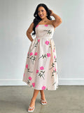 Step into summer with this playful plus-size A-line midi dress, featuring a charming rose print that blooms with every move. The strapless design keeps things breezy and fun, while handy pockets add a touch of practicality to your sunny-day style. Perfect for twirling through warm afternoons or casual garden parties, this dress combines comfort and flair effortlessly.