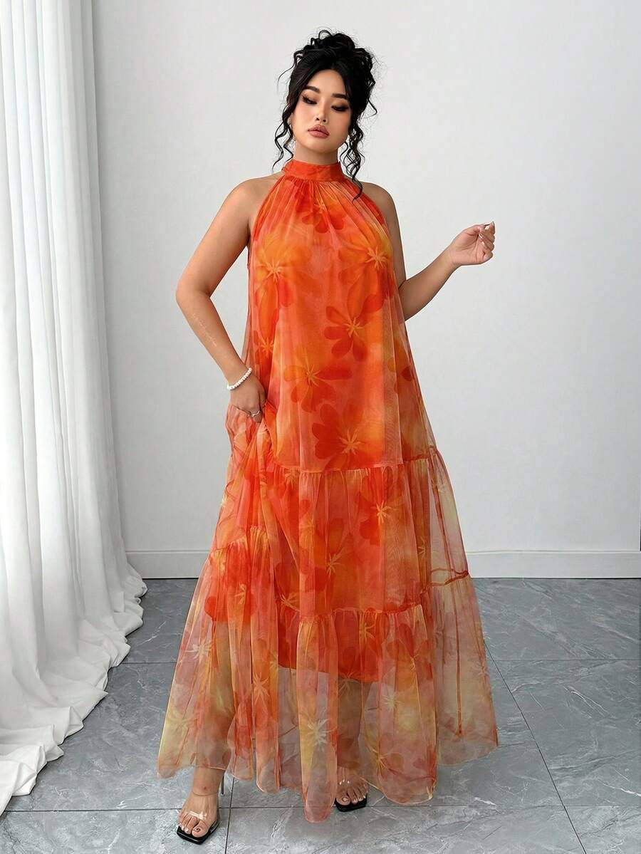Front view of plus size orange floral mesh halter maxi dress with inner slip