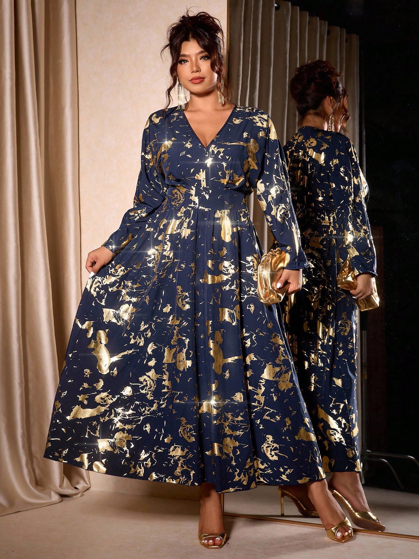 Shimmer into the season with this show-stopping metallic foil print dress! Designed for curves and confidence, this plus-size beauty features a flattering V-neckline and cinched waist that celebrates your silhouette. The eye-catching foil detailing catches the light with every move, making it perfect for holiday parties, festive gatherings, or any occasion calling for a touch of glamour. Comfortable yet chic, this dress proves that elegance comes in every size. Get ready to turn heads and feel absolutely fa