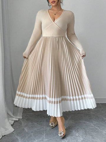 This stunning dress features a flattering V-neckline and a cinched waist, creating a beautiful A-line silhouette. Its retro colorblock design adds a touch of elegance, making it perfect for any occasion. Feel confident and stylish in this plus-size dress that highlights your curves.